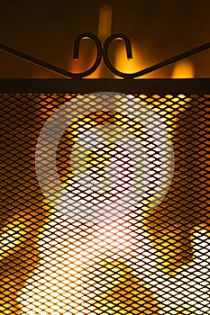 Metal surround in front of a fire