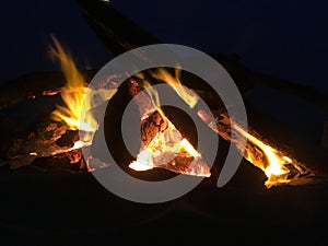 Fire on Beach during Full Moon Rising on Kauai Island, Hawaii.