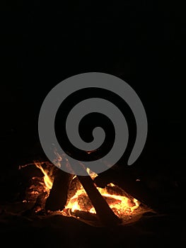 Fire on Beach during Full Moon Rising on Kauai Island, Hawaii.