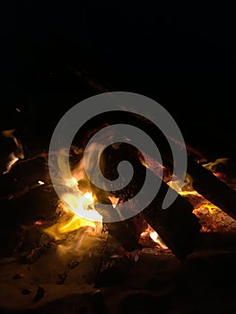 Fire on Beach during Full Moon Rising on Kauai Island, Hawaii.