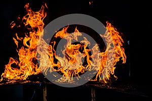 Fire blaze flames on black background. Fire burn flame isolated, abstract texture. Flaming explosion with burning effect