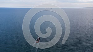 Fire boat on duty in the port water area. Aerial view