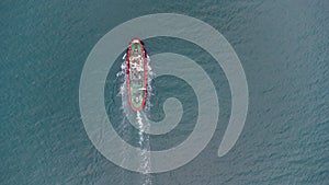 Fire boat on duty in the port water area. Aerial view.