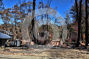 After the fire - burned houses and vehicles