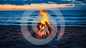 Fire is burning on a beach at sunset