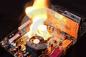 Fire Burning ,blazing computer motherboard, cpu,gpu and video card, processor on circuit board with electronic