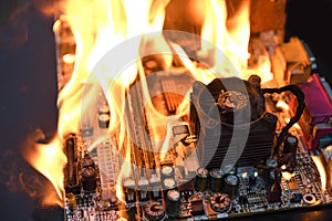 Fire Burning ,blazing computer motherboard, cpu,gpu and video card, processor on circuit board with electronic