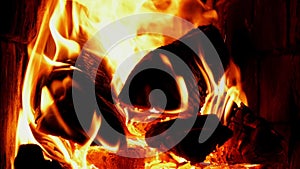 A Fire Is Burning In A Brick Village Stove. Flames, Hot Coals and Logs Close-up