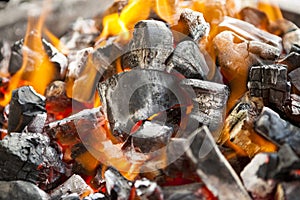 The fire, burning coals close up.