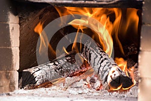 Fire burning in earthen oven