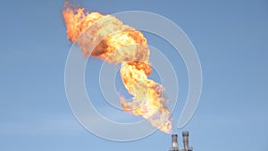 Fire burning on flare station in oil and gas production plant. The fire case in place and to be clear by firefighter. .