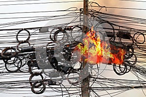 Fire burning High Voltage Cables power, Danger wire tangle cord electrical energy photo