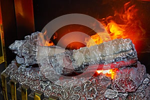 Fire burns in a fireplace