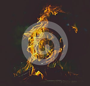 Fire at the camp side. Travel and adventure concept