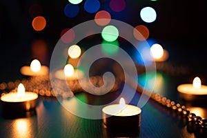 Fire of candle on christmas background. Christmas candles burning at night. Abstract candles background. 