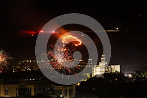 Fire caused by fireworks burns the hillside above the city on July 4th