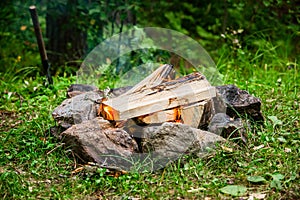 Fire in the circle of stones in the forest