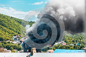 Fire. Close up of clouds of black smoke over a burning building. The concept of an emergency, disaster and insurance