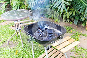 Fire coal in barbecue grill ready for cook in an outdoor backyard