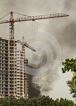 Fire At a construction site, unfinished multi-storey reinforced concrete building
