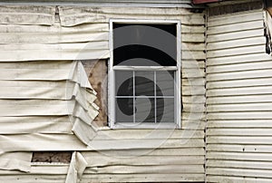 Fire Damaged Vinyl Siding And Window On A Home Exterior