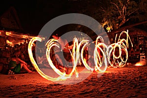Fire dance performance on the beach photo