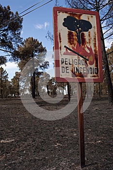 Fire danger sign after fire