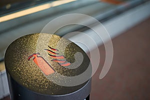 Fire danger sign on a garbage bin