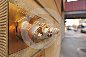 Fire department caps on outside of a building