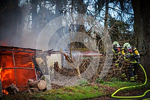 The fire department extinguishes a garden house