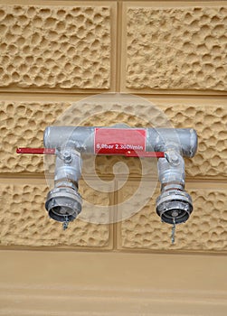 fire distribution pipe outlet water pipe from fire tank for intervention in case of house fire red metal pipe closures ball valve