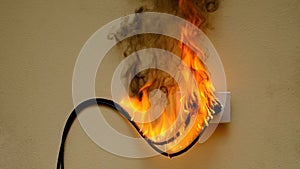 fire electric wire plug Receptacle on the concrete wall background