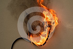 Fire electric wire plug Receptacle on the concrete wall background
