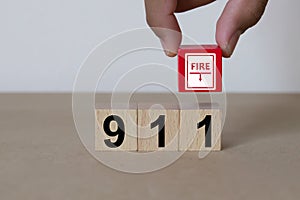 Fire Emergency Number 911 Services on wooden blocks.