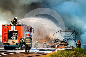 fire engine extinguishes a fire on the road