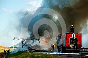 fire engine extinguishes a fire on the road