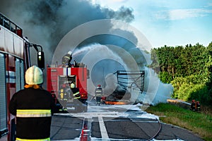 fire engine extinguishes a fire on the road