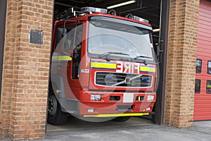 A fire engine leaving the fire station