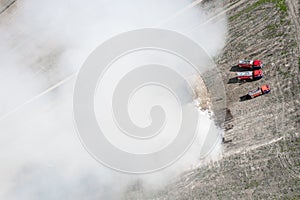 Fire engines extinguish straw top view