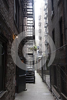Fire escape in a back alley on the side of a New York apartment block