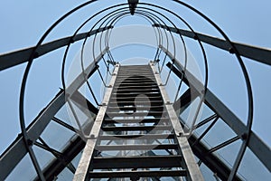 Fire escape ladder on a building office, iron staircase