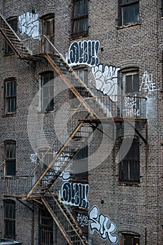 Fire escape stairs on an old building exterior in New York, Manhattan