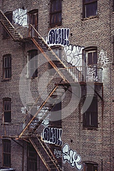 Fire escape stairs on an old building exterior in New York, Manhattan