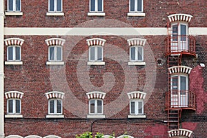 A fire escape was installed along the facade of a brick-built building in Lille (France) photo