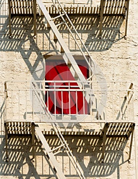 Urban fire escape, red window