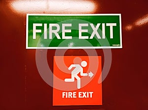 Fire exit door with symbol and arrow