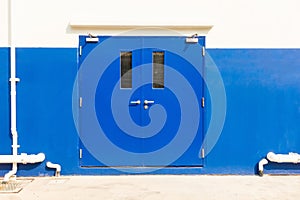 Fire exit door of warehouse building., Steel doors.