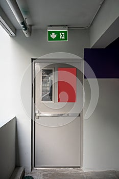 Fire exit emergency door grey color metal material and concrete