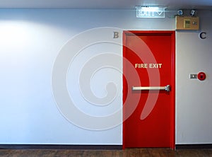 Fire exit emergency door red color metal material.