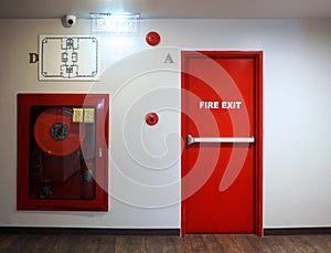 Fire exit emergency door red color metal material.